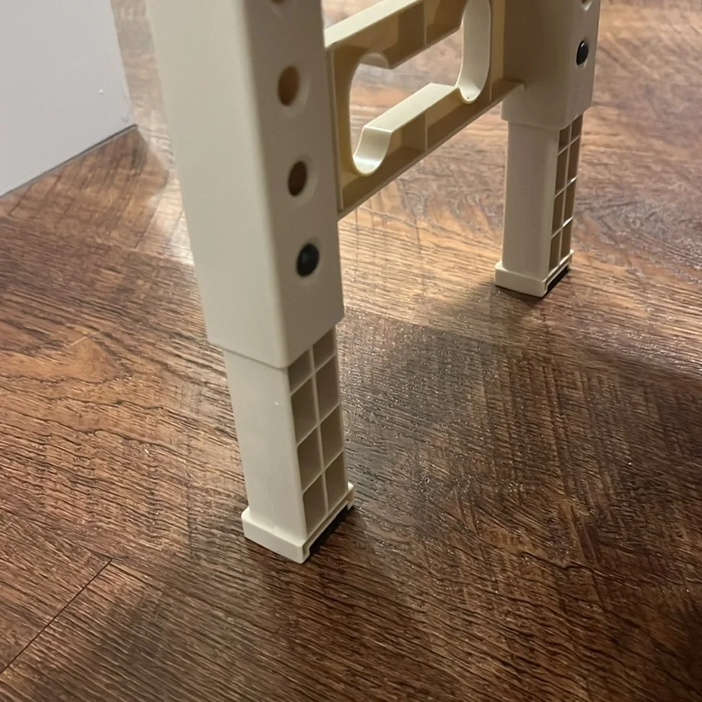Cream Colored Dog Feeder and Bowls